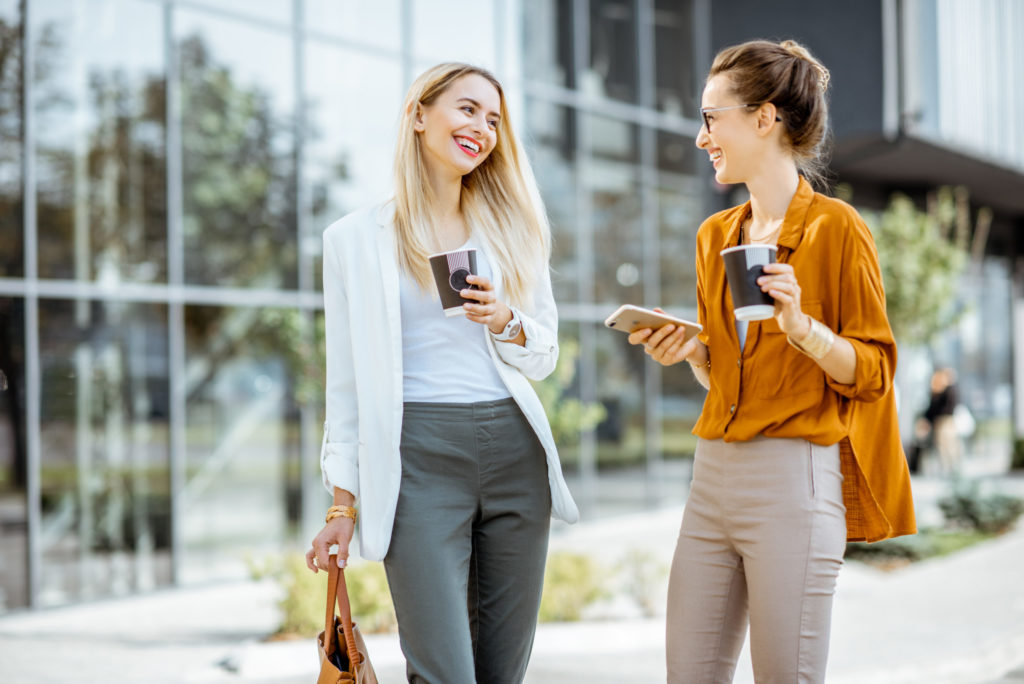 Businesswomen talking near the office building