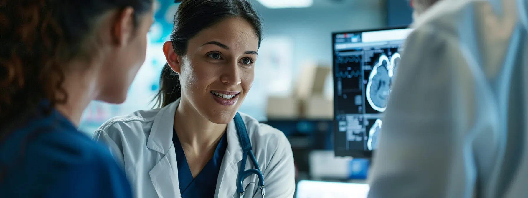 a healthcare professional engaging fully with a patient while a medical ai scribe transcribes their conversation.